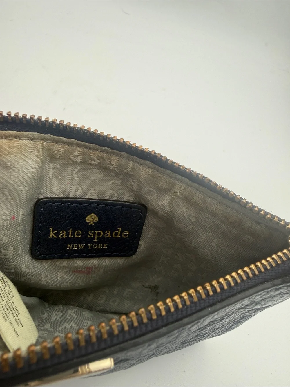 kate spade navy pebbled leather wristlet wi/  gold logo 6.5x4”